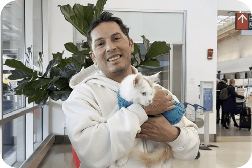 Happy family with their Cavalier puppy