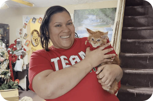Happy family with their Cavalier puppy