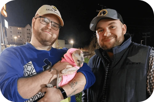 Happy family with their Cavalier puppy